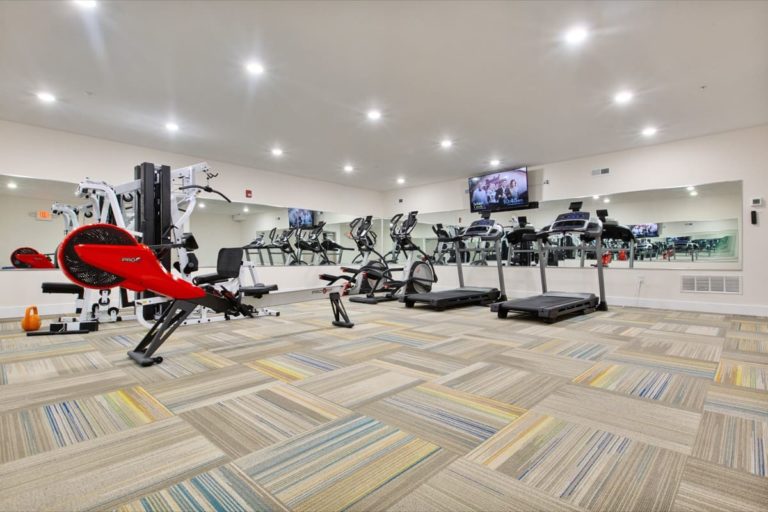 On-site fitness room at The View at Manayunk with treadmills, bikes and a weight machine
