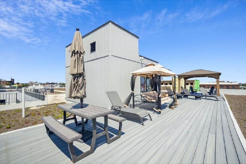 Rooftop deck and lounge area at The Mill at York Station with seating and open views.